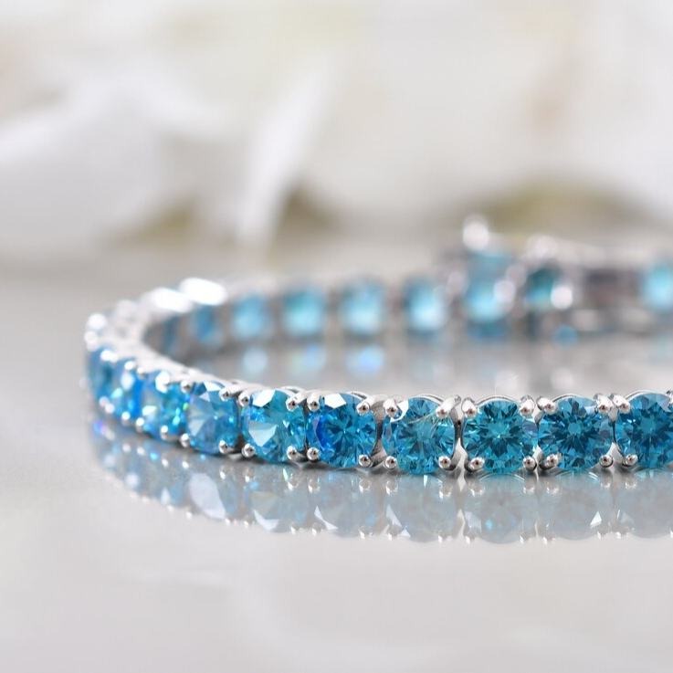 Vintage Sterling Silver & Rich Blue Topaz Tennis Bracelet